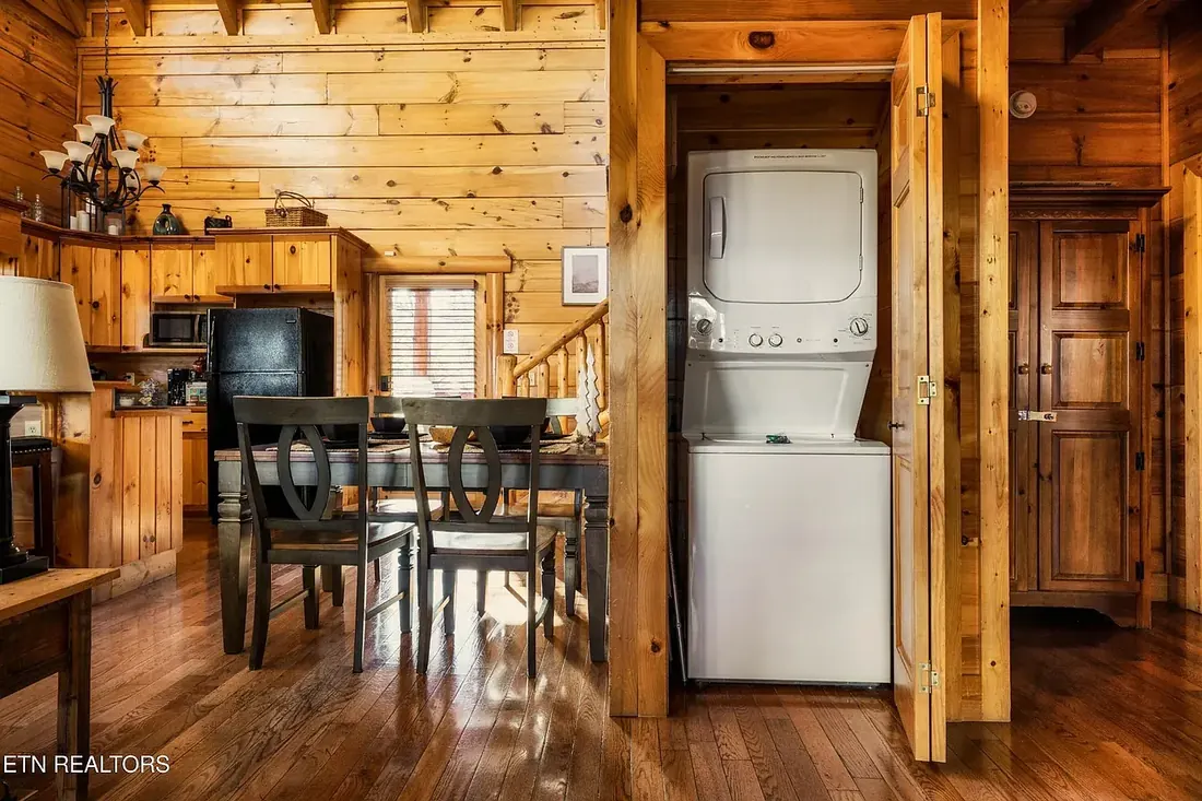Stacked washer and dryer in a built-in closet off the dining area